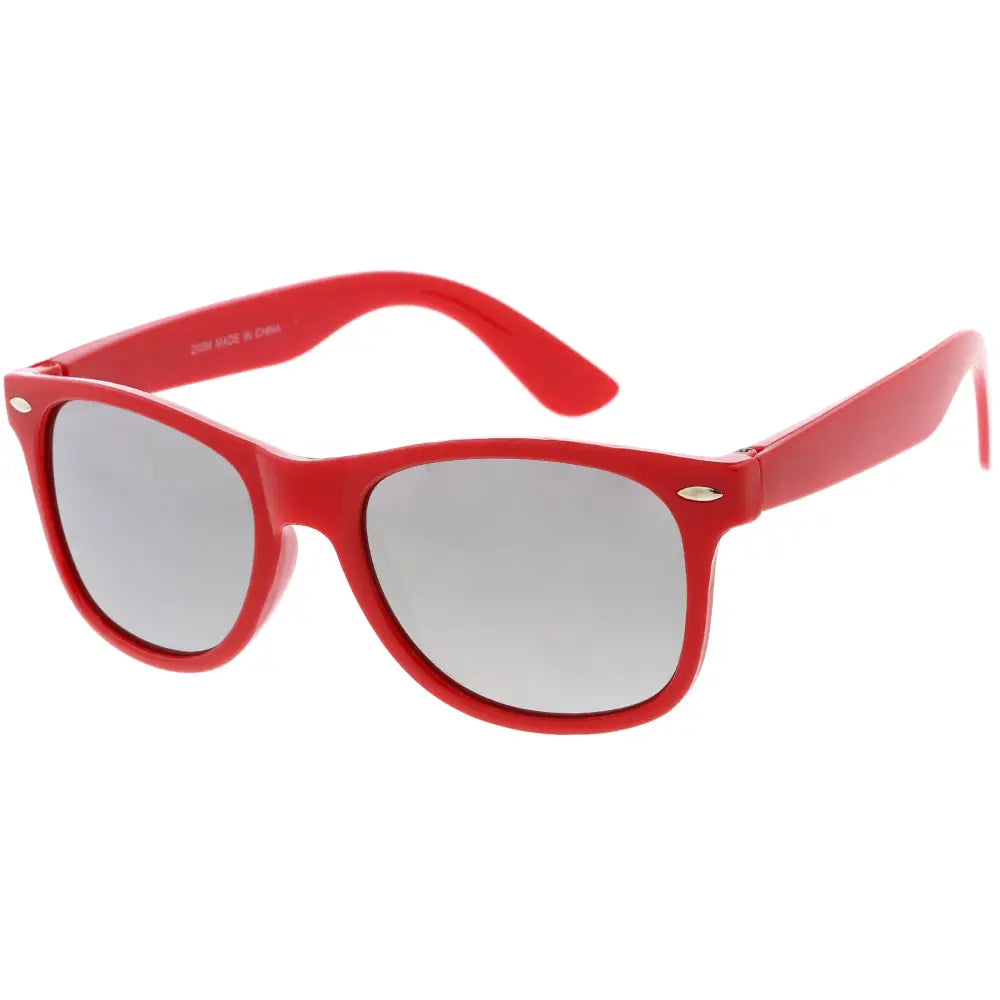 Red plastic-framed sunglasses with silver gradient lenses in a set of 12