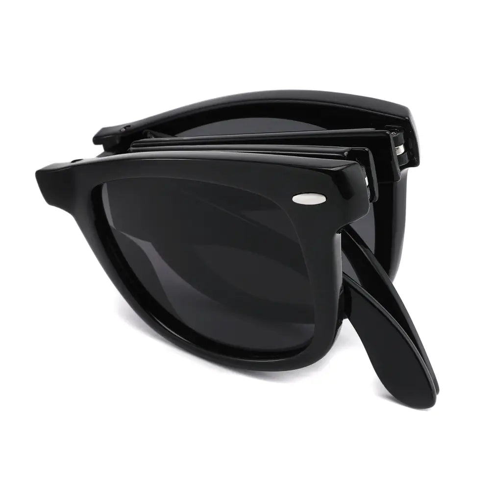 Black foldable sunglasses with spring hinges glossy finish and dark lenses in a set of 12