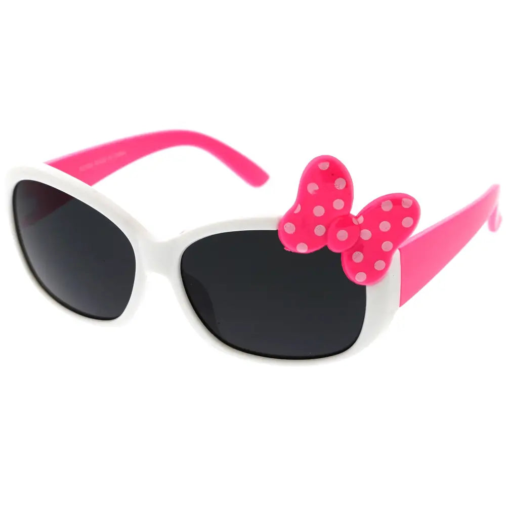 Pink and white children’s sunglasses with oval frames featuring a pink polka-dotted bow on the temple set of 12