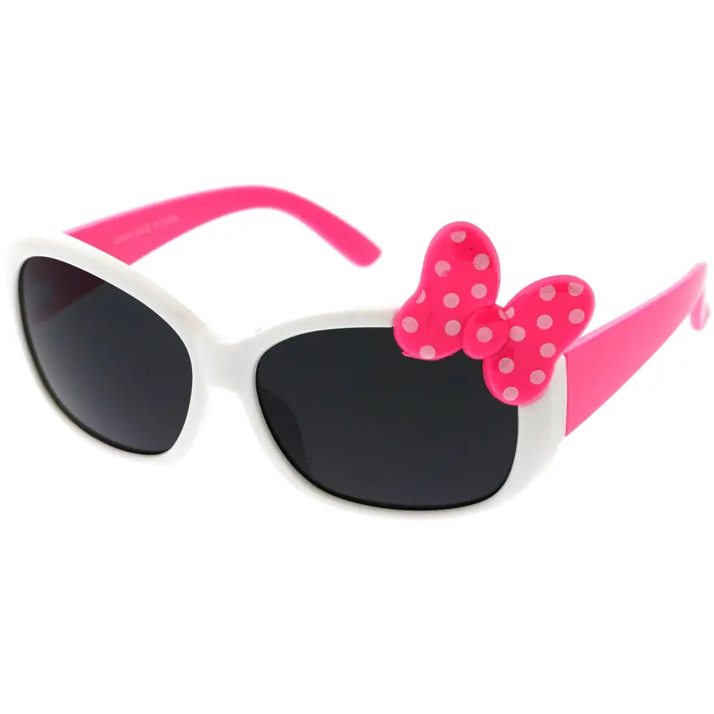 White and pink children’s sunglasses with oval frames and a polka-dotted bow on the temple kch64 set of 12