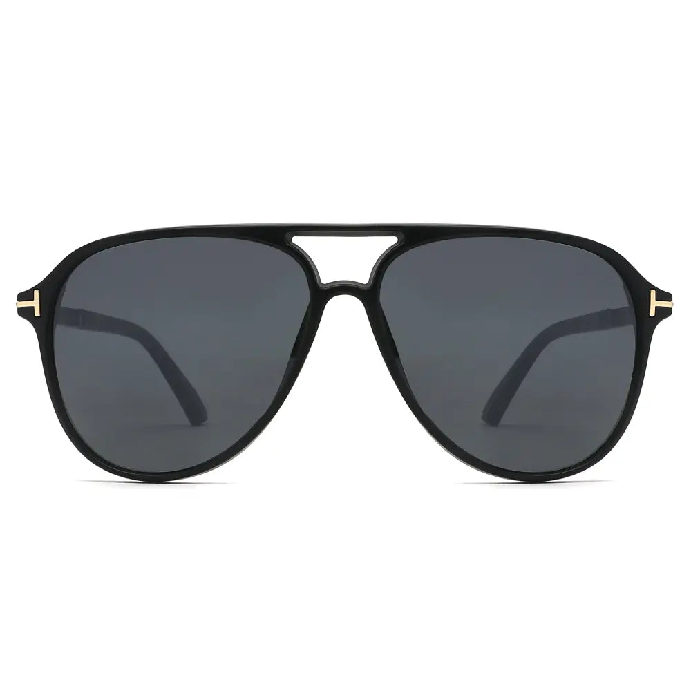 Black sunglasses with gold accents on a white background