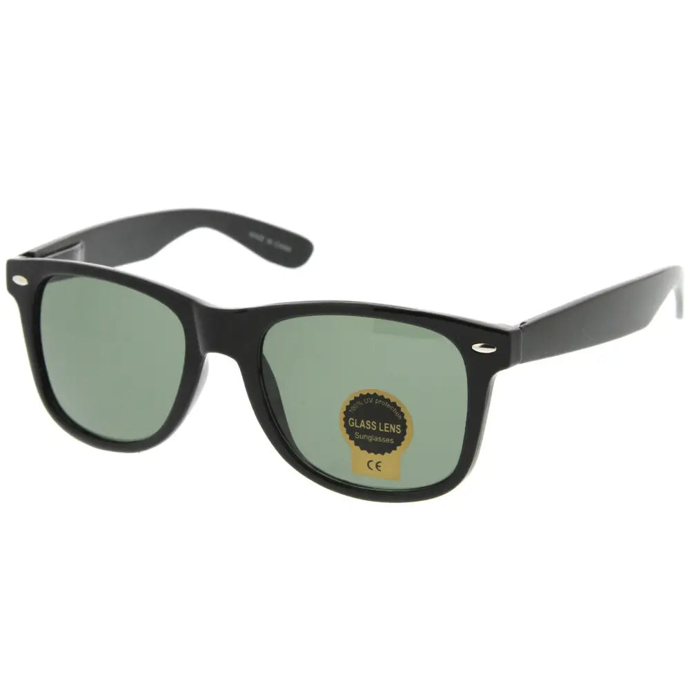 Set of 12 black-framed sunglasses with green-tinted lenses and rectangular shape labeled 100b