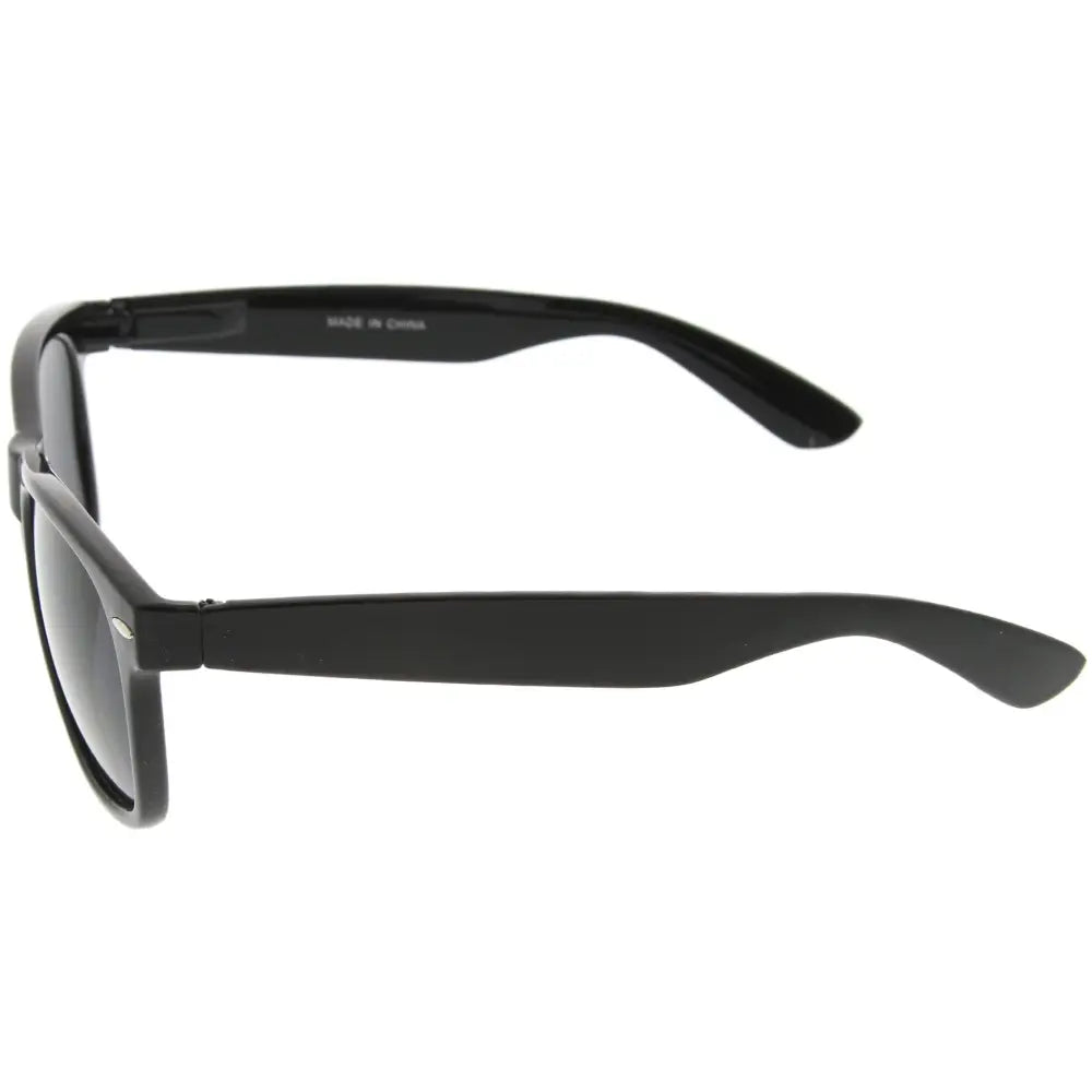 Black plastic-framed sunglasses with dark lenses in a 100d set of 12