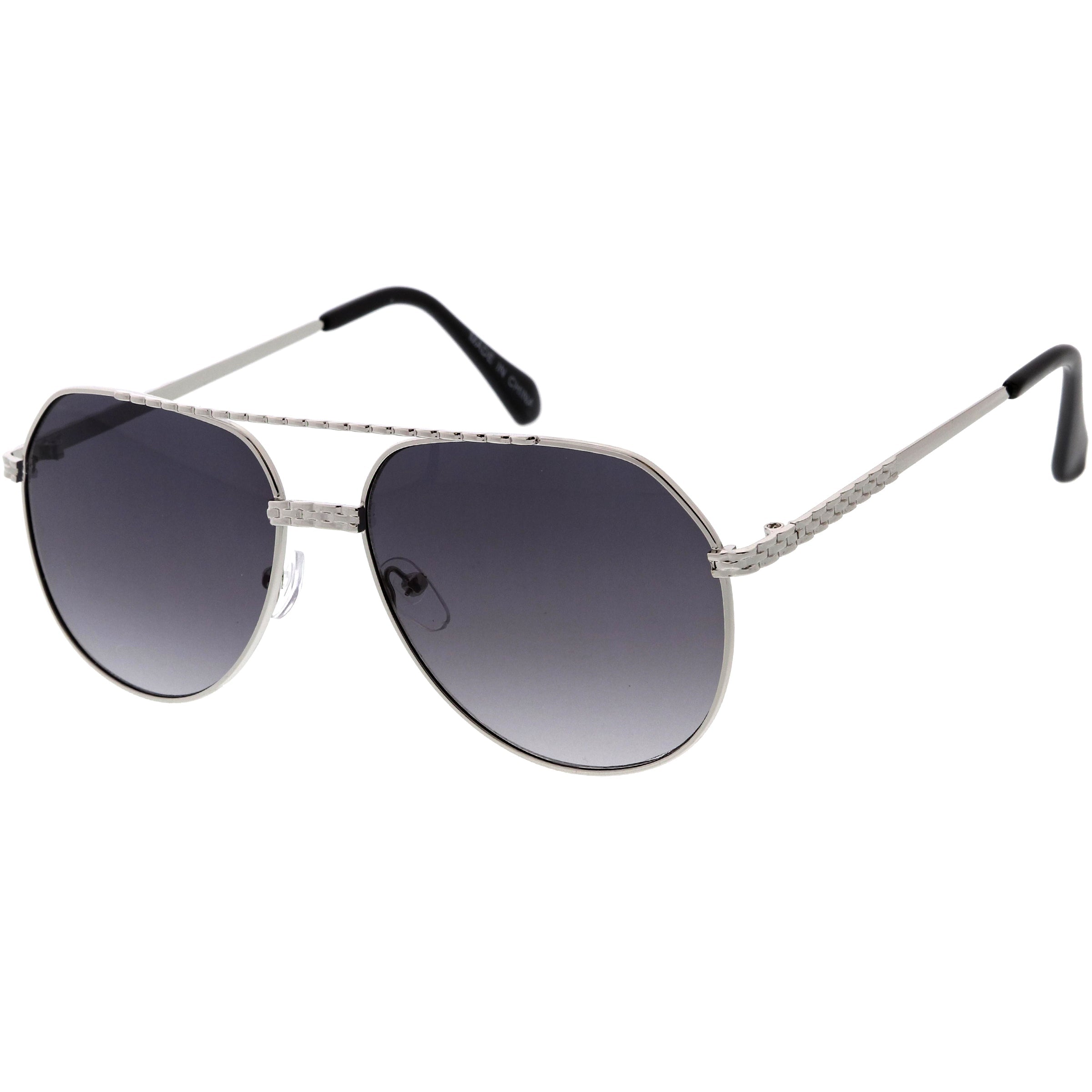 Stylish aviator sunglasses with metal frame and tinted lenses for a trendy, classic look.