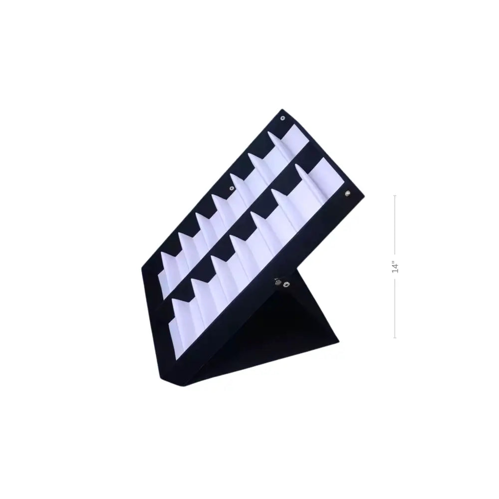 Black fabric display tray with 16 white triangular compartments for organizing small items
