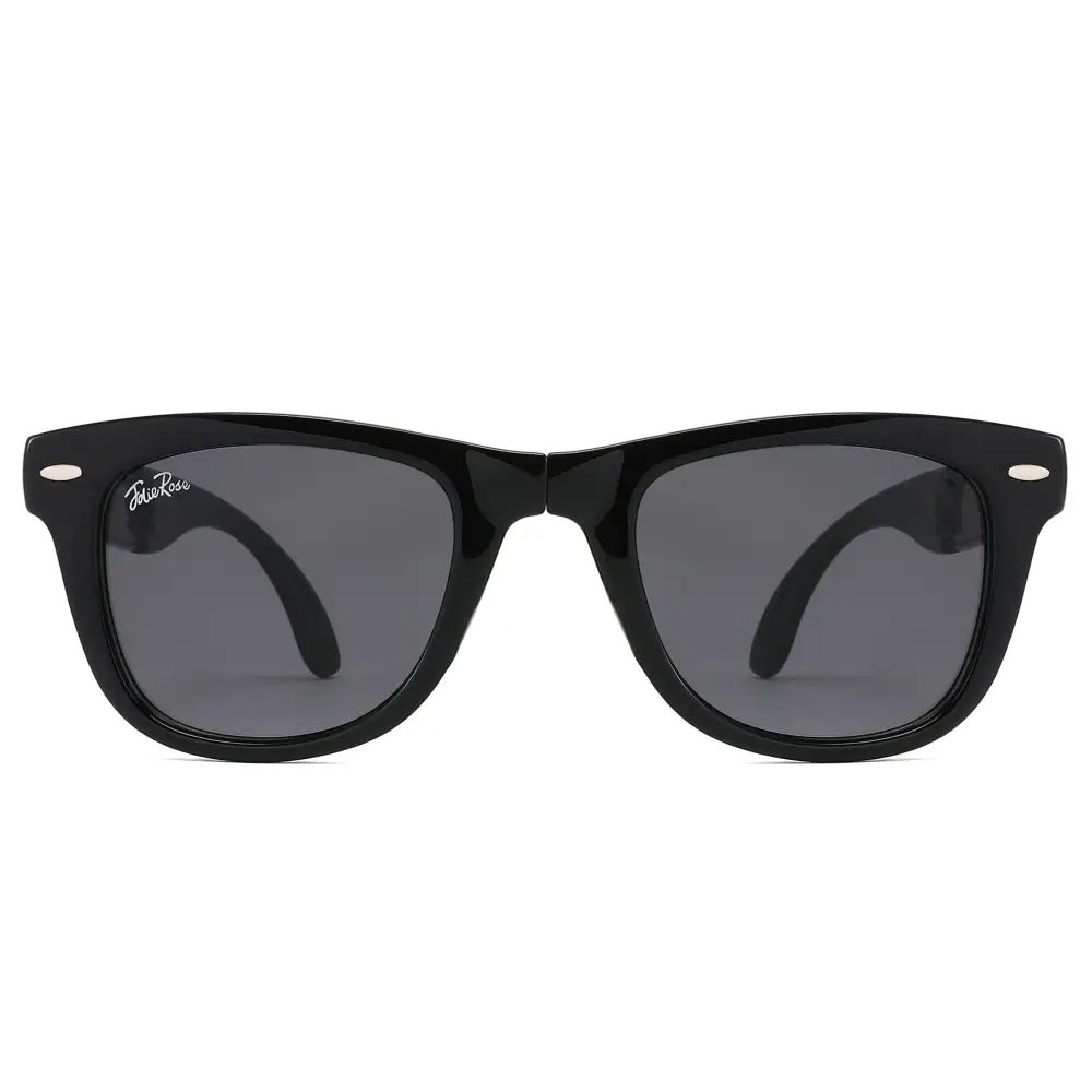 Foldable black plastic-framed sunglasses with dark gray lenses and spring hinges in a set of 12