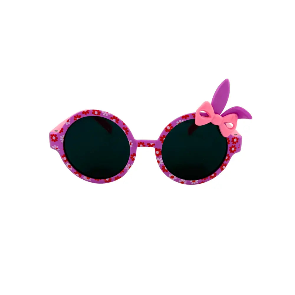 Pink floral-patterned kids sunglasses with oval lenses and a pink and purple bow on the right temple set of 12