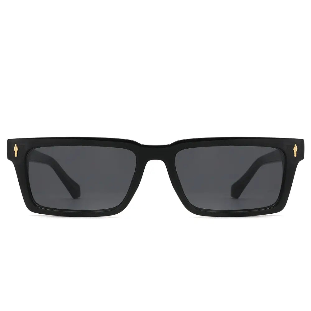 Black sunglasses with gold accents on a white background
