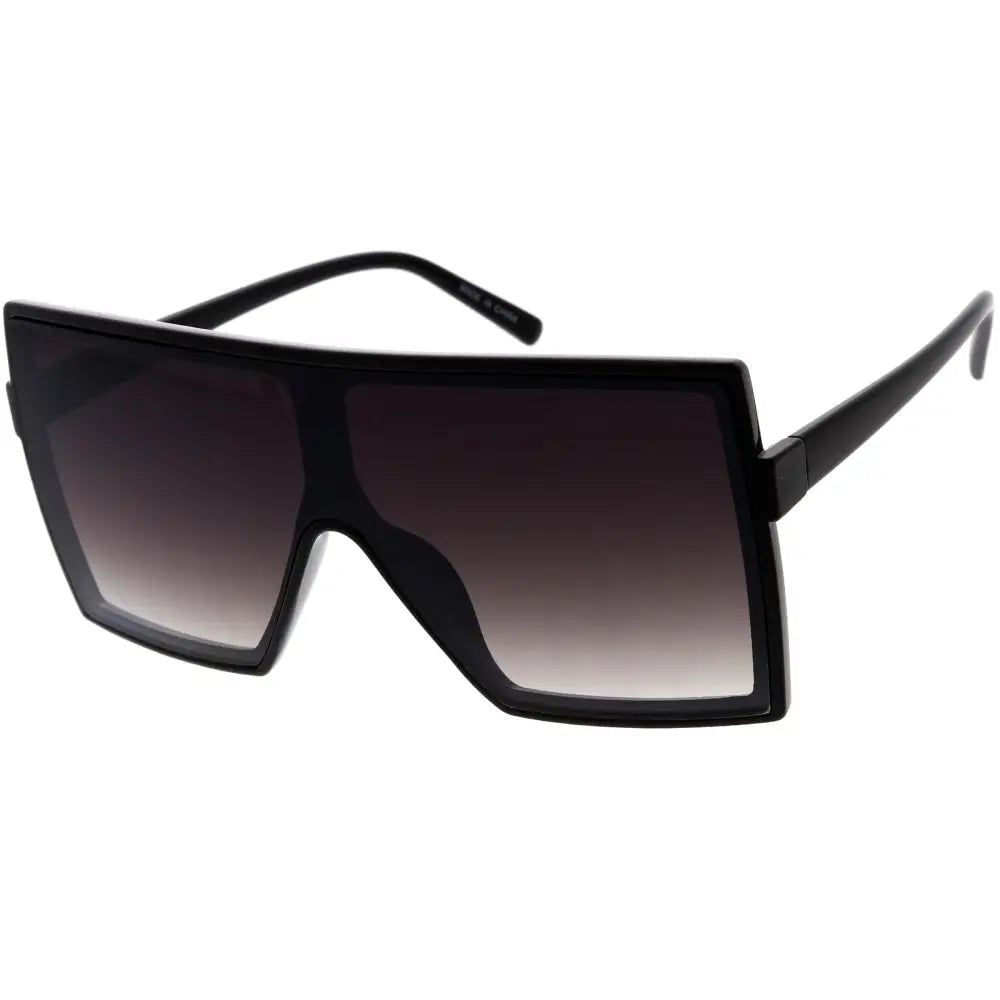 Black oversized sunglasses with bold angular frame and gradient lenses fading from dark to light set of 12