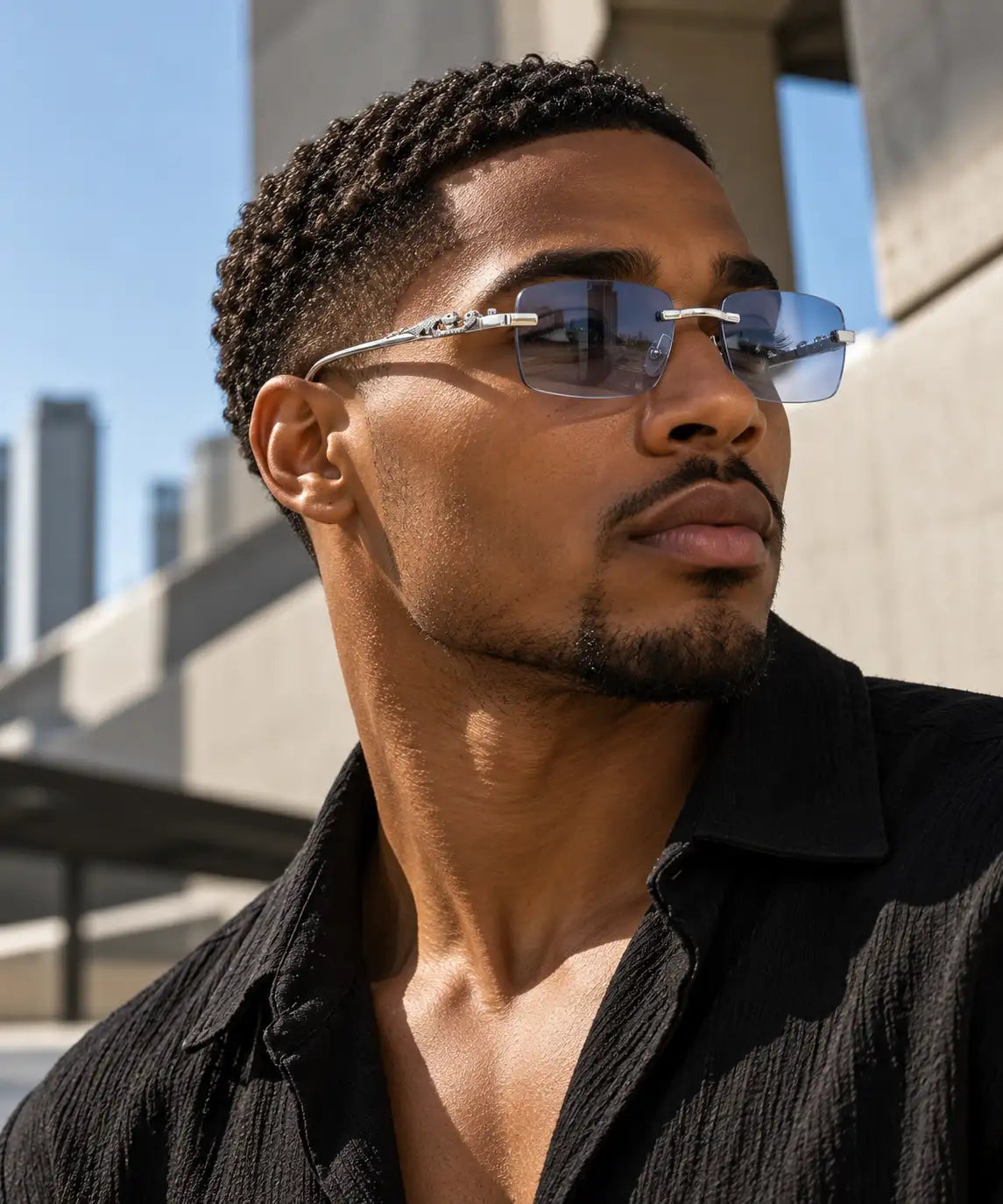 Silver-framed rectangular sunglasses with a sleek, modern design and light blue tinted lenses.